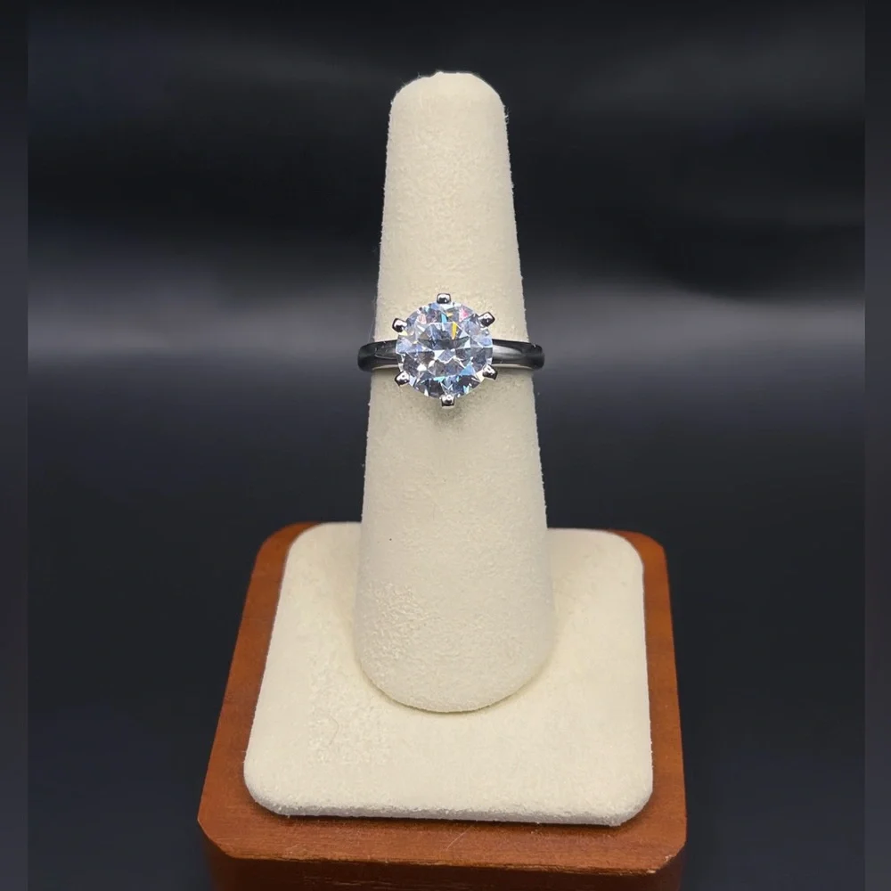 Two (2) carat cz solitaire in a 925 sterling silver setting. Size 6.25.